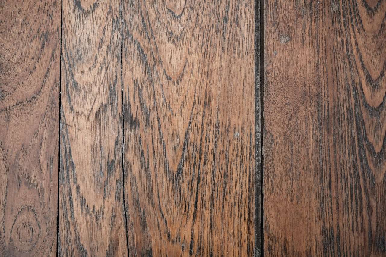 Close-up of rustic hardwood floor planks with natural grain and texture