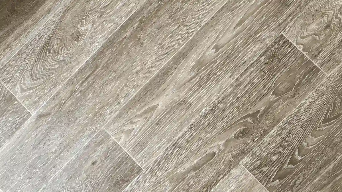 Light wood-look vinyl sheet flooring with visible plank pattern