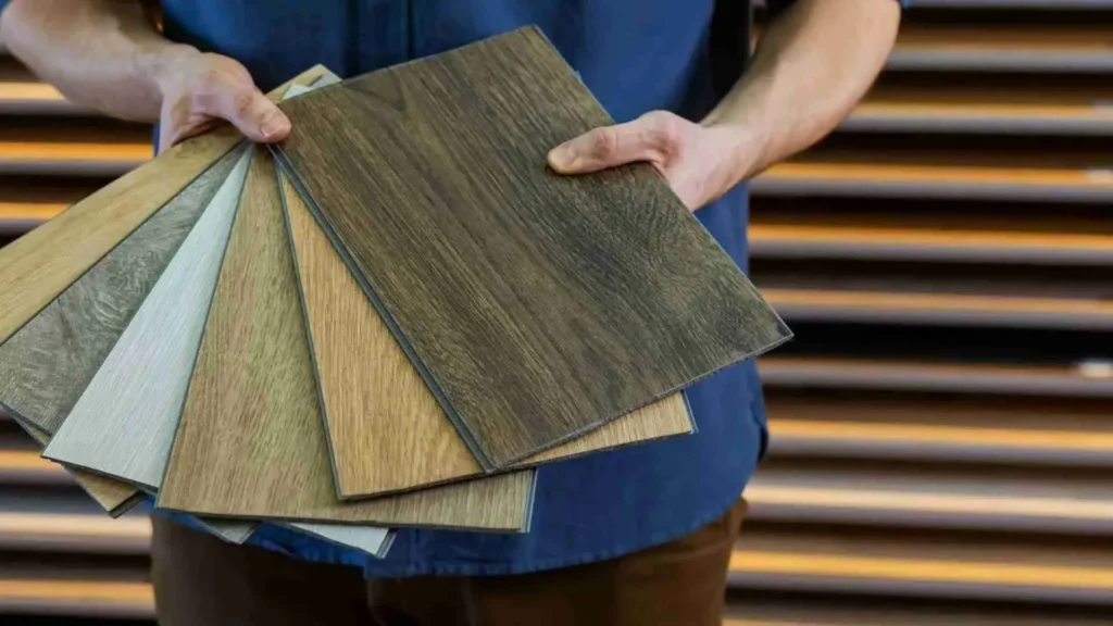 Laminate flooring samples in several wood tones and finishes